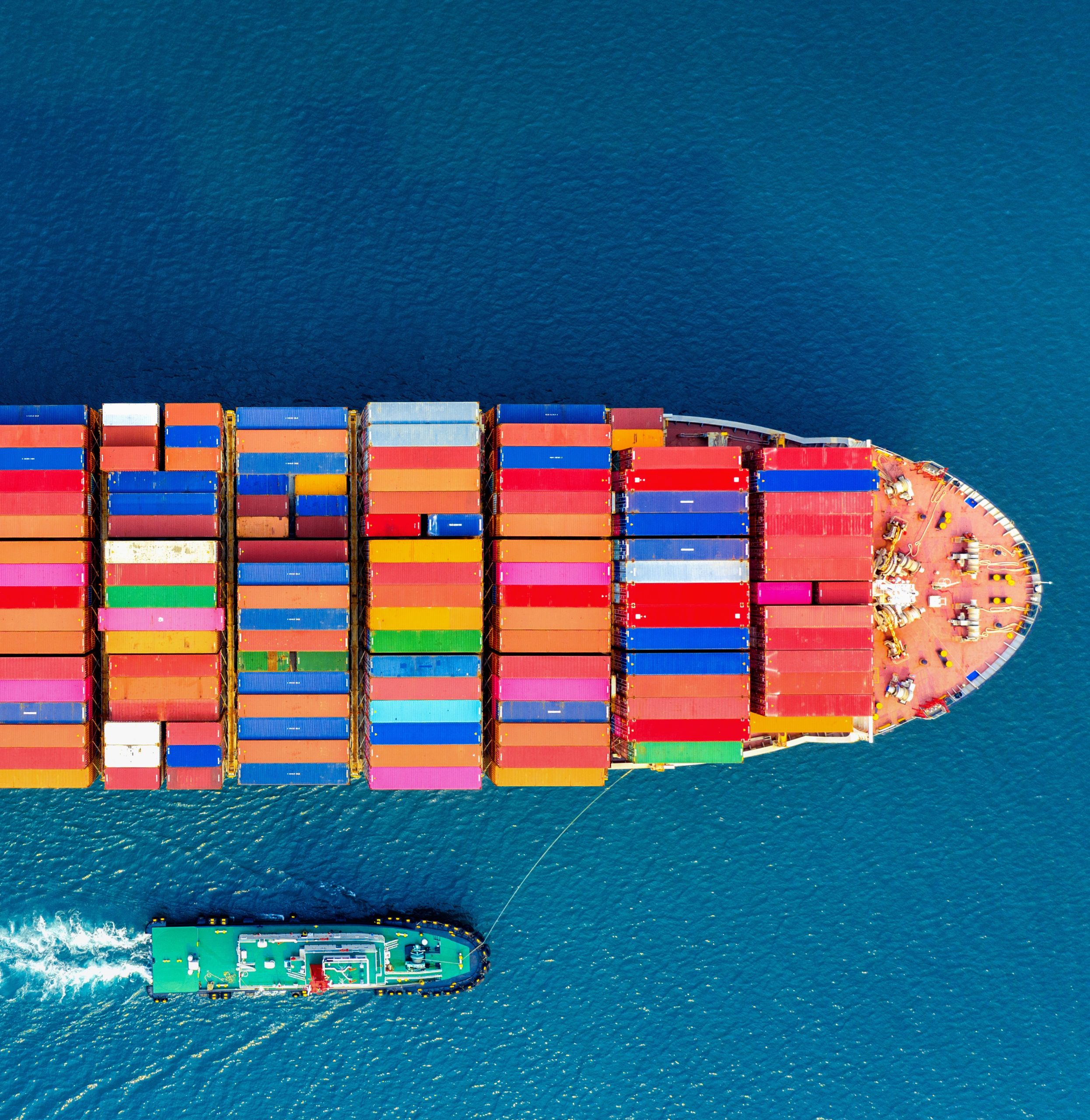 Aerial view of container cargo ship in sea.